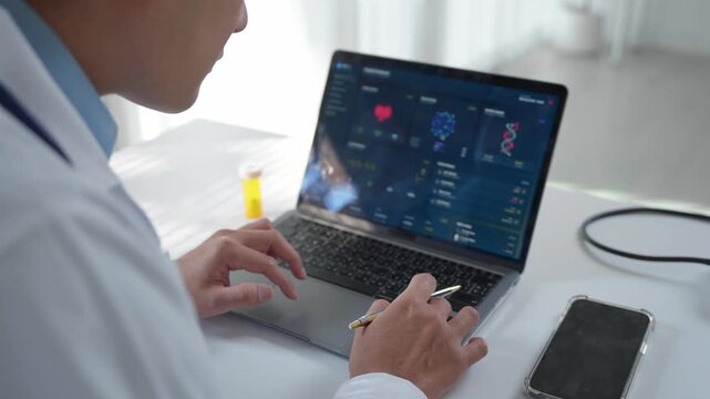 Medical professional working on a laptop computer in a hospital office, analyzing patient medical records with futuristic health data