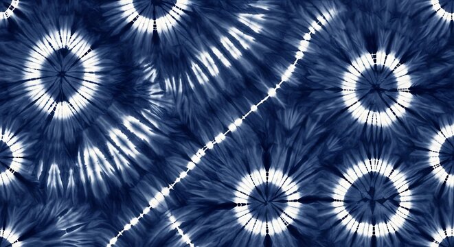 Seamless tie dye pattern with blue and white circular sunburst shapes and decorative lines for textile design