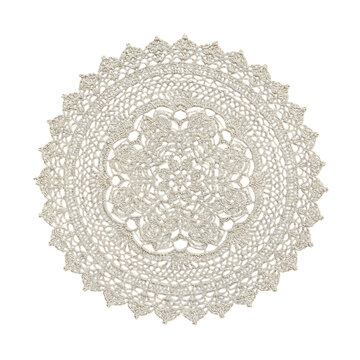 Intricate beige lace doily on white background