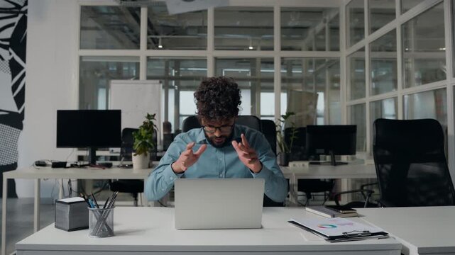 Annoyed Arabian business man throwing away documents mistake incorrect data businessman headache pain male employer sad at office with laptop corporate fail low stats unsuccessful deal throw papers