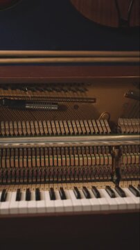 Open Upright Piano with Microphones &mdash; Slow Vertical Pan