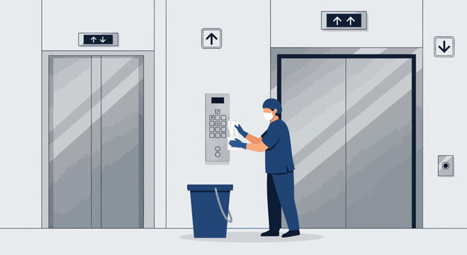 Janitor Cleans Elevator Buttons with Disinfectant Wipes for Hygiene