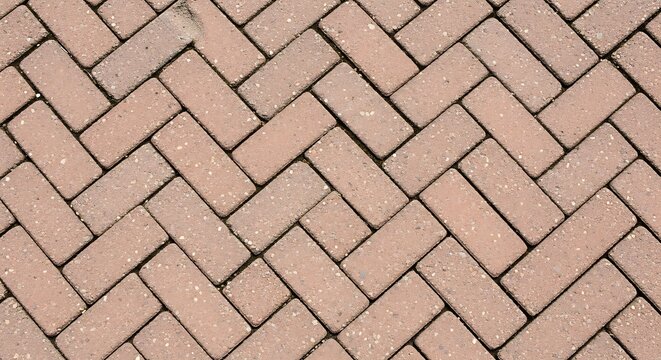 Herringbone pattern of red clay paving bricks on a walkway