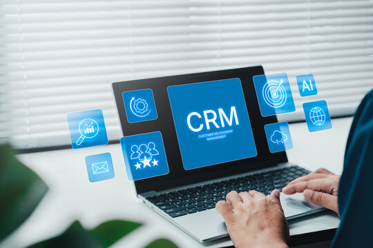 Businessman professional using laptop with CRM optimization dashboard icon on virtual screen, AI assistant Customer Relationship Management analytics for business technology, modern office environment