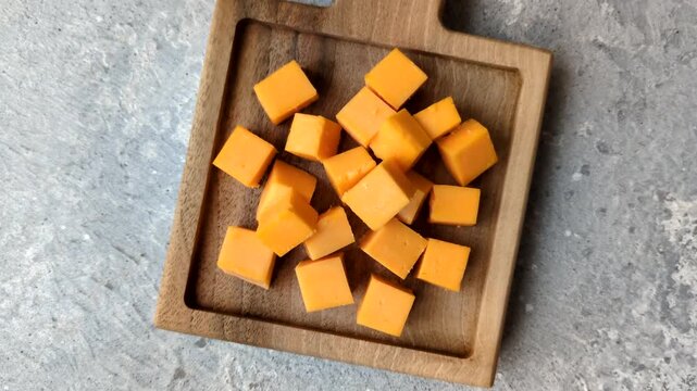 Hard yellow cheddar cheese for sandwiches or pasta. Cheddar cheese as a food background for your design