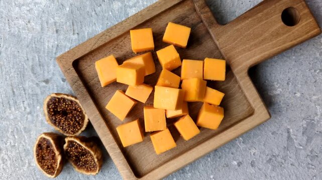 Hard yellow cheddar cheese for sandwiches or pasta. Cheddar cheese as a food background for your design