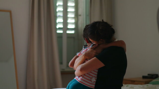 Mother scolds child for misbehavior then checks head injury and embraces him showing emotional parenting cycle discipline care concern and reassurance in authentic family scene