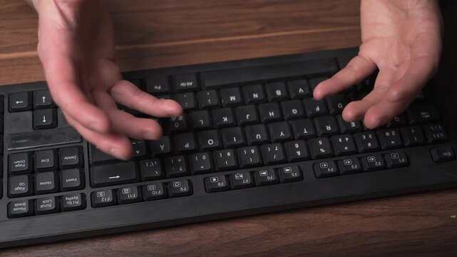 Overhead view frustrated typing hands followed by ctrl alt del keyboard shortcut