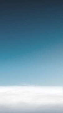 Drifting Clouds Above Soft Horizon Under Starry Blue Sky Background Loop