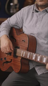 Hollow-Body Archtop Jazz Guitar &mdash; Fingerpicking with Studio Bokeh