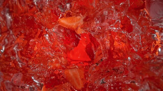 Super Slow Motion Shot of Fresh Strawberries Falling into Water at 1000fps.