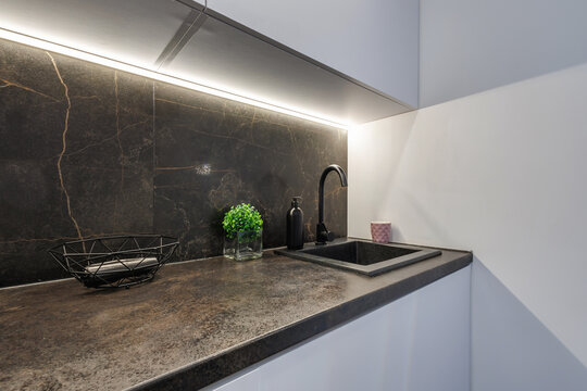 Interior of the modern luxure kitchen work area  in studio apartments in minimalistic style