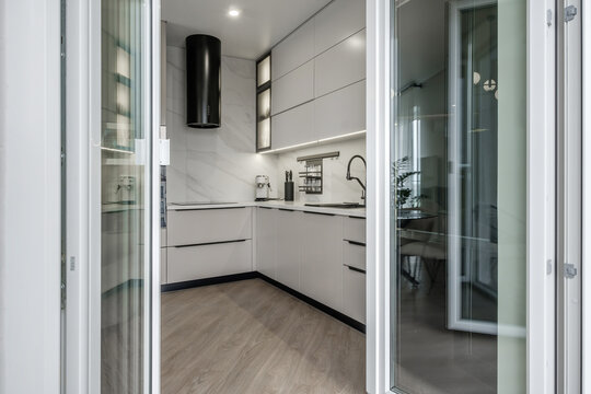 Interior of the modern luxure kitchen work area  in studio apartments in minimalistic style