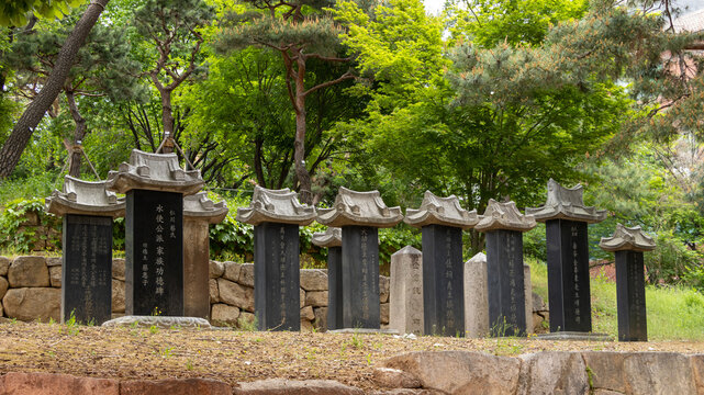 Row of traditional Korean stone monuments biseok with ancient inscriptions