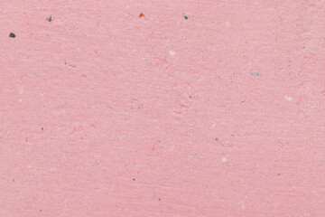 Fototapeta premium Pastel pink handmade paper texture, tactile background with abstract speckled pattern close-up