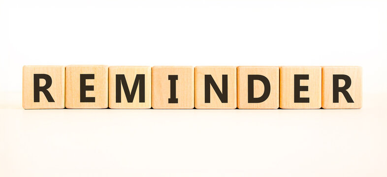 Reminder word symbol. Concept word Reminder on beautiful wooden blocks. Beautiful white background. Business support help reminder word concept. Copy space.