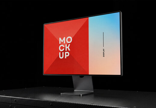 Perspective view of a desktop computer monitor screen mockup standing on a carbon fiber textured surface table against a solid black background