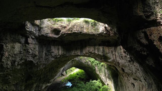 Aerial Descent Revealing Skylights and Entrance of Devetashka Cave