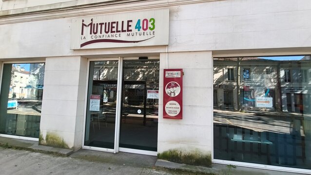 Saintes, France - April 21, 2026: Saintes. Mutuelle 403 insurance office exterior with large glass windows and signage in a city setting, showcasing modern architecture