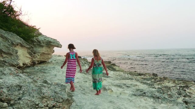 Two little girls walk near Tsarevo in Bulgaria