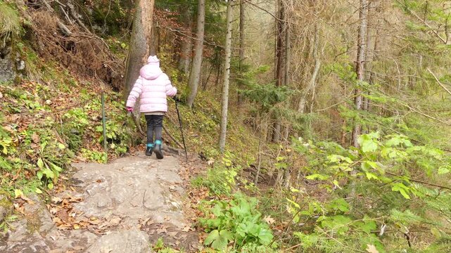 Two little beautiful girls walk in Slovak Paradise. Slovak Paradise (Slovensky raj) is mountain range in eastern Slovakia, part of Spis-Gemer Karst, located between towns of Spisska Nova Ves.