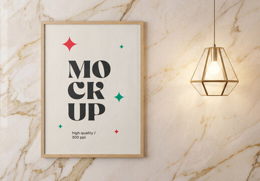 Front view of a vertical wooden framed poster mockup hanging on a luxury beige marble wall next to a glowing geometric pendant lamp