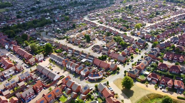 Aerial View Of Barton Seagrave Kettering With Detached Houses, Gardens And Curving Streets In Summer Light