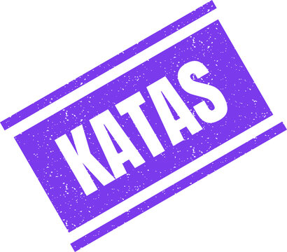 Purple rectangular rubber stamp imprint with the word Katas featuring a distressed and textured surface