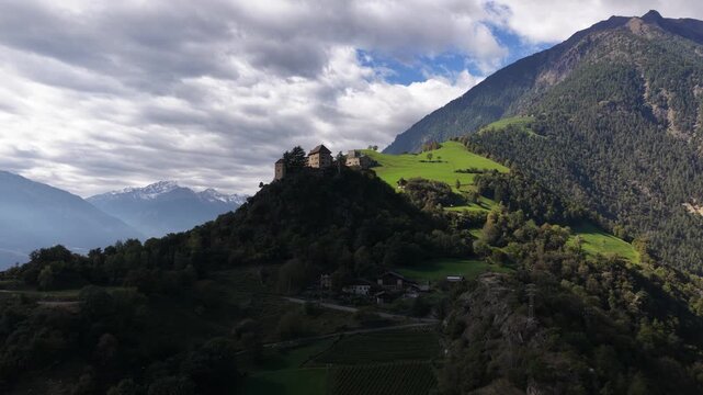 Scenic aerial view of juval castle on a hill in the italian alps