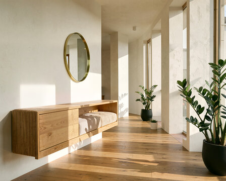 Modern wooden console table with cushion in sunlit minimalist hallway featuring potted plants and round mirror.