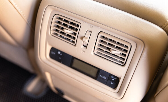 Car air conditioning. The air flow inside the car. Car ventilation close-up. Details of the front panel of SUV with air diffusers. Car Interior.