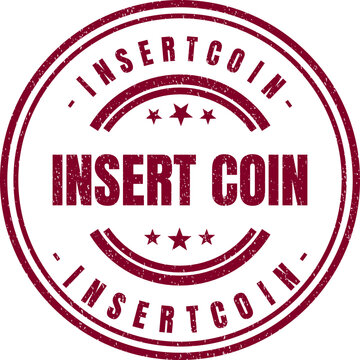 A round red rubber ink stamp that features the text insert coin in center design