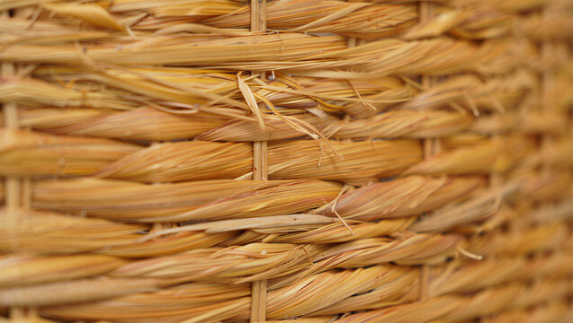 Close-up of woven rattan texture background with background material handmade structure interwoven interior sustainable ecological abstract minimalist naturalistic materialistic