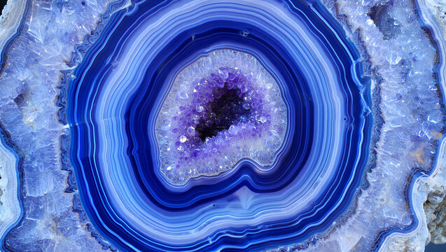 Blue agate geode slice with concentric crystal mineral rings formation background abstract gemstone decorative polished specimen mineralogy amethyst aesthetic creation