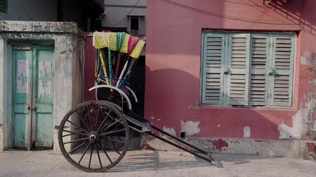 A hand-pulled rickshaw stands by the doorway; it is one of the most nostalgic symbols of Kolkata.