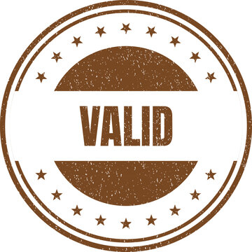 Circular brown rubber stamp featuring the word valid and decorative stars on clean surface