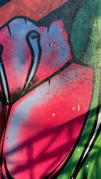 old graffiti on the wall with peeling paint