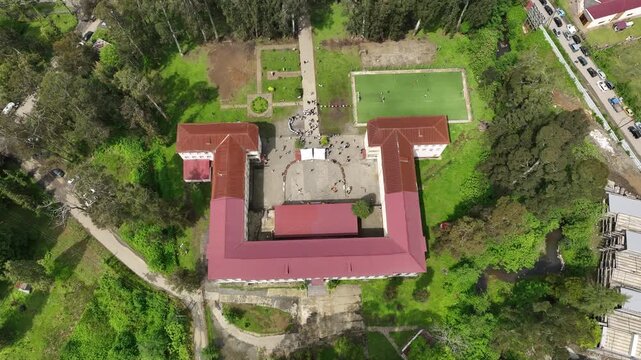 Chakvi, Georgia &mdash; May 22 2026: Aerial drone view of Public School N1 building complex surrounded by lush green trees and coastal landscape in Adjara region.