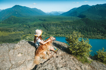 Woman Relaxing with Golden Retriever Above Rattlesnake Lake, Washington © Victoria Nefedova