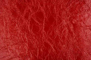 Fototapeta premium Macro shot of red cracked leather texture