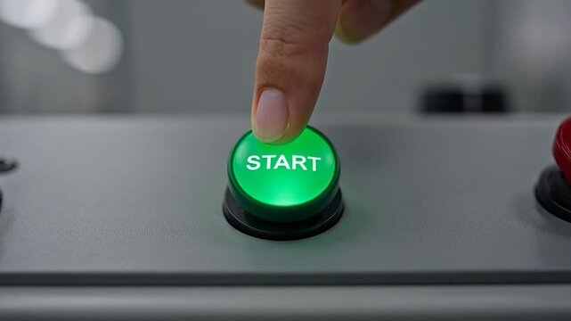 ?Pressing a start button to activate machinery in closeup sequence