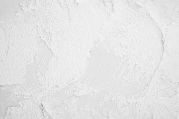 White textured wall surface with rough plaster details © reddish