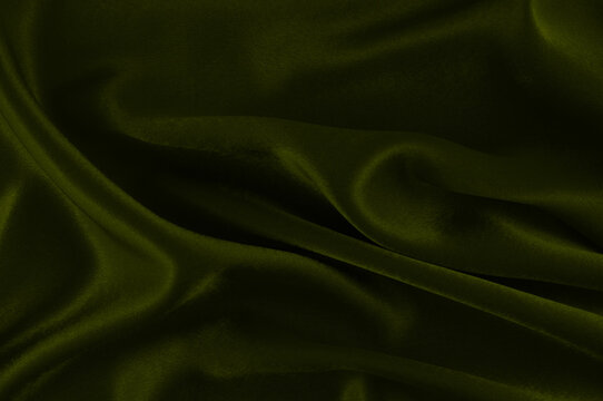 Olive green velvet fabric draped texture background
