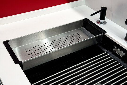 Sink basin with metal drainer tray and soap dispenser