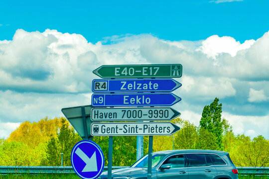 Directional road signs on a highway in Belgium