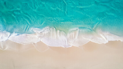 Fototapeta premium Aerial View of Turquoise Waves at Sandy Beach
