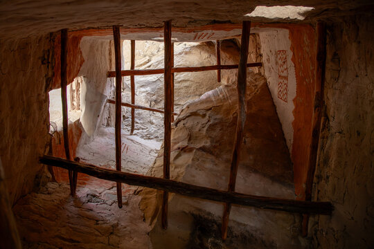 Looking upward within a reinforced vertical chamber in an Anasazi cliff dwelling at Cliff Palace in Mesa Verde National Park, ancient pictograms visble