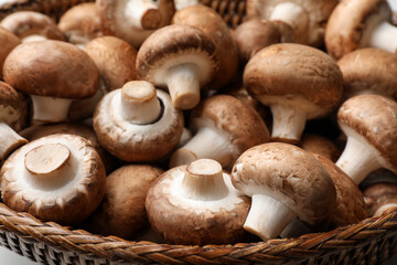 Fototapeta premium Fresh brown champignon mushrooms in bowl, closeup