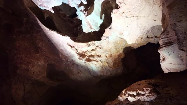 Dramatic illuminated cave ceiling and walls revealing intricate boxwork formations inside Wind Cave National Park
