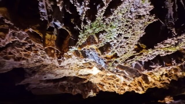 Dramatic illuminated cave ceiling and walls revealing intricate boxwork formations inside Wind Cave National Park